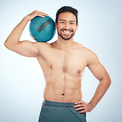 Image showing Man, body or medicine ball on studio background for fitness workout, training or exercise for healthcare wellness, muscle growth or goals. Portrait, smile or happy bodybuilder with weight motivation