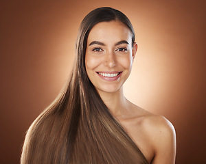 Image showing Hair, beauty and portrait of woman in studio for wellness, hair treatment and shampoo products. Hair salon, hair care aesthetic and girl face with healthy, natural and long hair on brown background