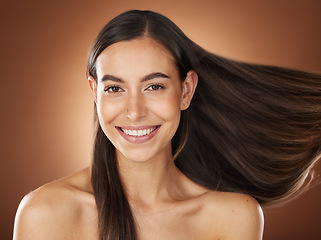 Image showing Face portrait, hair care and beauty of woman in studio isolated on a brown background. Wellness, hairstyle and aesthetics of female model with healthy and long hair after salon treatment for growth.