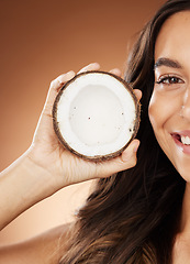 Image showing Coconut skincare woman, smile and studio with happy self care, fruit nutrition or cosmetic health. Model, skin wellness or beauty for coconut oil, moisturizer or cosmetics background for natural glow