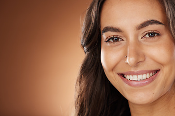 Image showing Hair, beauty and portrait of woman in studio for wellness, hair treatment and shampoo products. Hair salon, hair care aesthetic and girl face with healthy, natural and curls shine on brown background