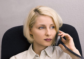 Image showing Close-up of businesswoman talking on phone in office