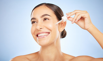 Image showing Face, skincare and woman with serum for beauty in studio on a background. Thinking, cosmetics and female model with hyaluronic acid, essential oil and dropper product for healthy skin and anti aging.