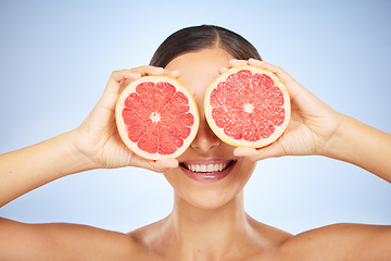 Image showing Beauty, health or woman with grapefruit for skincare wellness, facial cleaning or natural vitamin C in studio. Smile, cosmetics or happy girl model marketing fruit to detox for a glowing smooth face