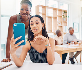 Image showing Selfie, friends and a business black woman posing for a photograph in the office with her colleague. Phone, diversity and social media with a female employee and coworker taking a picture at work