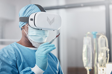 Image showing Virtual reality, medical and doctor with a surgery simulation in operation room in the hospital. Vr, healthcare and male surgeon practicing and analyzing the human anatomy with futuristic device.