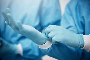 Image showing Healthcare, hands and doctor with gloves in hospital ready for surgery, operation or procedure. Safety scrubs, latex ppe and medical professional, surgeon or nurse in operation theater in clinic.