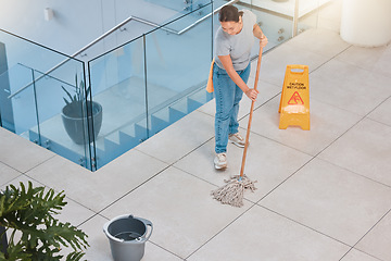 Image showing Cleaning service, office building or woman mopping floor with warning sign for job safety compliance. Bucket, bacteria or girl cleaner working on wet floor for dirty, messy or dusty tiles on ground