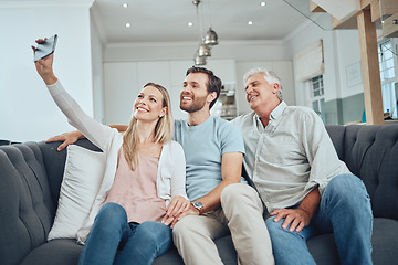 Image showing Selfie, phone and happy family on a sofa in the living room relaxing and bonding in their modern home. Happiness, love and young couple taking a picture on a cellphone with a senior man in a lounge.
