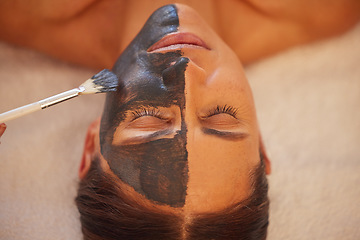 Image showing Spa, woman and charcoal face mask, skincare and luxury for health, wellness and clear skin. Beauty, cosmetics and girl with organic facial, healthcare and detox for cosmetology, acne and massage.