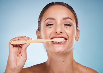 Image showing Brushing teeth, dental and woman with toothbrush for teeth whitening and beauty, oral health and fresh breath with studio background. Mouth wellness, Invisalign portrait and clean with bamboo brush.