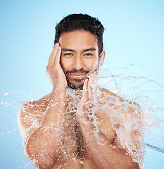 Image showing Portrait, water splash or man in shower in studio cleaning his face or body for beauty, skincare or self love. Wellness, luxury or healthy male model washing body in natural grooming morning routine