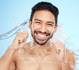 Image showing Dental, teeth floss and water splash with man in portrait for hygiene, cleaning and oral healthcare against studio background. Teeth whitening, clean mouth and fresh breath with smile and Invisalign