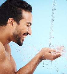 Image showing Water, hands or man in shower in studio cleaning body for wellness or skincare with a happy smile. Water splash, mock up or relaxed model washing for self care grooming with marketing or mockup space