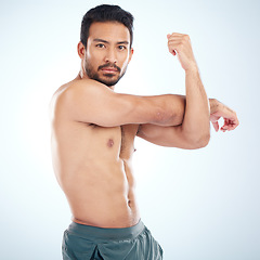 Image showing Man, body or stretching arms on studio background in workout start, exercise pain relief or training healthcare wellness. Portrait, sports athlete or fitness model warm up of strong muscles