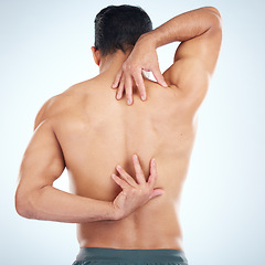 Image showing Man, body or stretching back muscles on blue background in studio pain relief, healthcare wellness or burnout tension release. Sports athlete, fitness model or coach flexing in workout success check