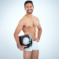 Image showing Asian man, scale and lose weight wellness for fitness workout, exercise goals motivation and health training in studio. Self care, healthy body and personal trainer happiness for happy lifestyle