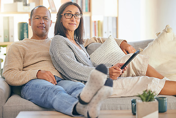 Image showing Mature couple, tablet and relax portrait on sofa together for love, support and romance bonding in living room at home. Man smile, happy woman, and romantic quality time on couch with tech device