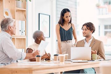 Image showing Laptop, documents or business people in a meeting planning a marketing, branding or advertising strategy. Team work, data analysis or employees working in collaboration on paperwork for sales growth