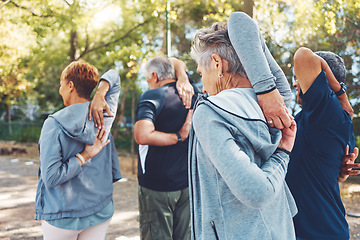 Image showing Fitness, nature and senior people doing stretching exercise before cardio training in a park. Health, wellness and active group of elderly friends in retirement doing arm warm up for outdoor workout.