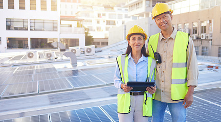 Image showing Solar energy, building and engineer team portrait with tablet, smile or rooftop for sustainability. Man, woman and solar panel in city for renewable energy on roof with mobile tech, teamwork and goal