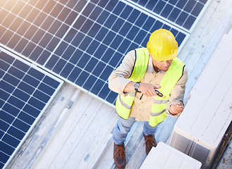 Image showing Air conditioning, technician or engineer on roof for maintenance, building or construction of fan hvac repair. Air conditioner, handyman or worker with tools working on a city development project job