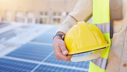 Image showing Engineering, solar energy or hand with helmet for safety while working on photovoltaic development project. Industry hat, solar panels or construction worker working on building rooftop maintenance