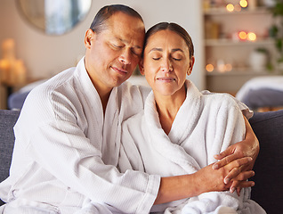 Image showing Hug, relax and mature couple at a spa with zen, calm and stress free mindset before a treatment. Man and woman embracing with love while relaxing at luxury health, wellness and beauty salon together.