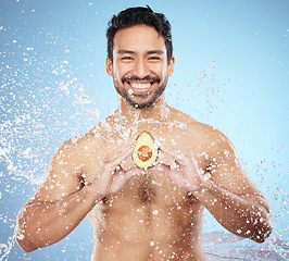 Image showing water splash, avocado or portrait of man with skincare, beauty or natural organic products for a glowing body goals. Smile, face or happy male model cleaning or washing with vegan cosmetics in studio