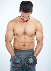 Image showing Fitness, studio or strong man training with dumbbells for powerful arms, biceps growth or muscles development. Wellness, motivation or healthy bodybuilder in exercise or workout with focus or goals