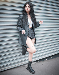 Image showing Young woman, fashion and streetwear with gen z punk style, outdoor and trendy, edgy and stylish in urban city. Youth, focus and beauty with rock aesthetic, fashion model in designer clothes in London