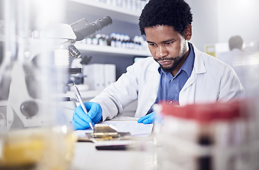 Image showing Black man writing report for science study, scientist in lab for research to test and experiment for scientific innovation. Biotechnology in laboratory, focus and knowledge, pen and checklist.