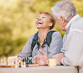 Image showing Happy, chess or couple of friends in nature playing a board game, bonding or talking about a funny story. Park, support or healthy senior people laughing at a joke and enjoying quality relaxing time