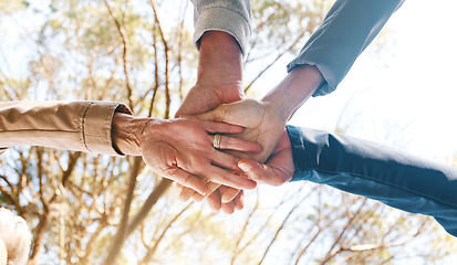 Image showing Partnership, hands or team in nature with support, trust or hope for goals or community group success. Collaboration, trust or people with team work, motivation or growth mindset together in a park