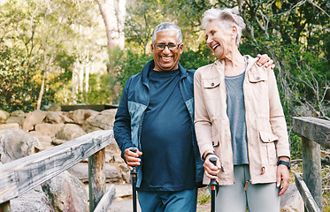 Image showing Relax, senior or couple of friends hiking, walking or trekking for freedom, exercise or fitness in nature forest. Interracial, travel or happy woman enjoys bonding time with healthy elderly partner