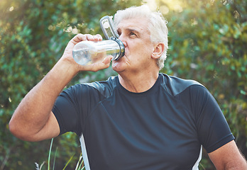 Image showing Exercise, senior man and water bottle for fitness, wellness and health in nature. Elderly male, athlete and hydration after training, rest and workout for cardio, power and energy in park and relax.