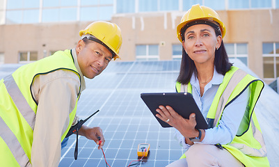 Image showing Tablet, solar energy or engineering team working solar panels or technology on rooftop for renewable energy. Teamwork, portrait or construction workers on a city building for maintenance inspection