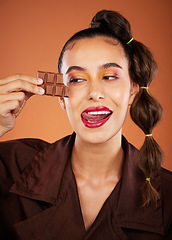 Image showing Makeup, beauty and woman with face, chocolate and lipstick, tongue out and color with cosmetics. Candy, luxury and microblading with skincare, sweets with hair care and lips against studio background