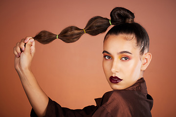 Image showing Hair, beauty with hair care and woman, makeup and cosmetics with lipstick, eye shadow and microblading against studio background. Portrait, long hair and healthy growth with glow and shine.