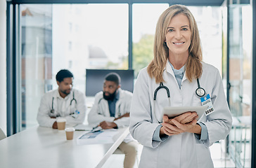 Image showing Doctor, tablet and senior woman, leadership and health with medical innovation, technology and digital hospital schedule. Network, stethoscope and healthcare portrait with smile, success and vision.