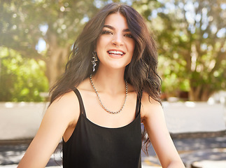 Image showing Fashion, park and beauty portrait of woman with luxury designer clothes, necklace accessory and relax in outdoor nature. Spring trees, healthy hair and happy gen z girl with trendy black shirt