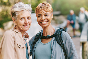 Image showing Elderly women, smile and hiking with fitness outdoor, trekking with friends and retirement, vitality and active life. Portrait, exercise and cardio, happy hiker in park, travel and nature adventure.