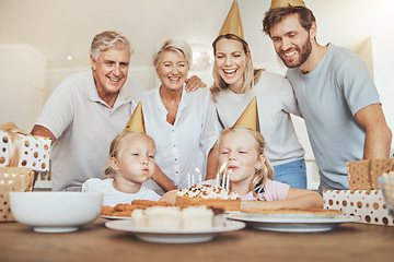 Image showing Parents, grandparents and children with candles on birthday cake for celebration with family, love and sweets in home. Happiness, men and women together at table at girl kids party event in apartment