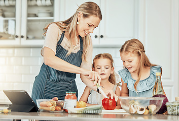 Image showing Happy woman in kitchen, cooking together with kids and teaching, learning and nutrition with tablet. Online recipe, mam and girl children help making healthy food in home with care, support and love.