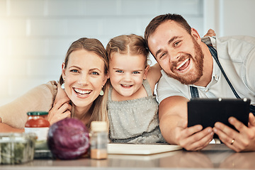 Image showing Happy family, cooking and parents with child in a kitchen to prepare a meal with online recipe in a home together. Bonding, smile and portrait of kid hug mother and father in a house with food