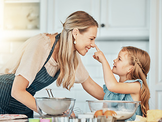 Image showing Playful mom in kitchen, baking together with kid and happy learning, nutrition and morning with woman. Smile, mother and girl child, cooking or playing in home with care, support or love at breakfast