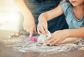Image showing Hands, baking and parent help child with cooking in a home kitchen learning to prepare cookies or biscuits recipe. Development, table and mother teaching kid a food hobby in a house together
