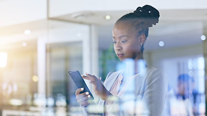 Image showing Business woman, phone and office window for marketing communication, social media and company email in reflection. African worker typing on mobile for professional chat, contact or search information