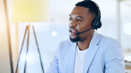 Image showing Call center, crm and black man talking for telemarketing, tech support or contact us at help desk in office. Customer service, sales agent and serious consultant in communication, advice and business