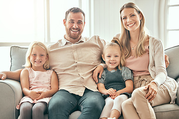 Image showing Happy family, portrait and relax on living room sofa for bonding, weekend or holiday together at home. Mother, father and children smile, hug and sitting on couch for summer break or rest at house